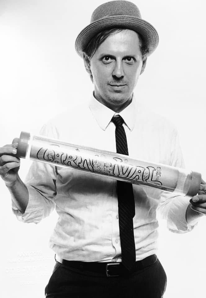 Here is Joseph Makkos holding one of his iconic historic newspaper archival tubes.