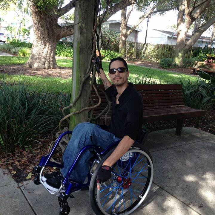 Tony Torres in a wheelchair with shades.